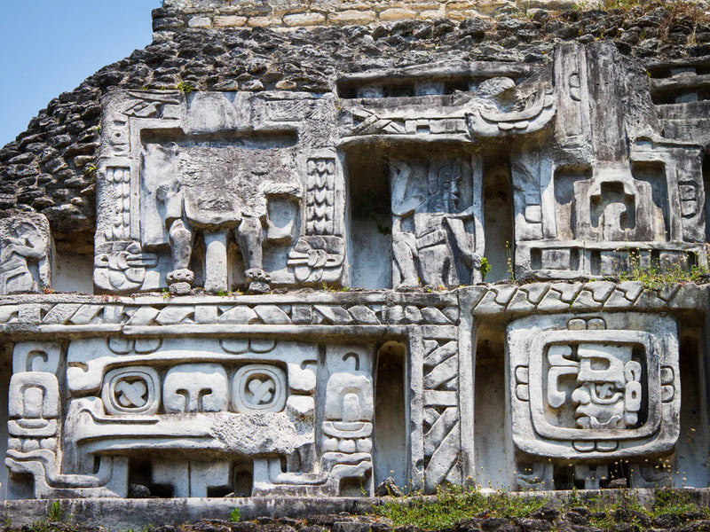 Mayan temple with intricate carvings on a clear day; Xunantunich Mayan ruins, Cayo, Belize