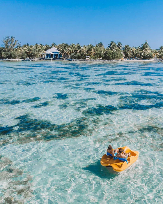 Belize Cayo Espanto paddling portrait private island resort