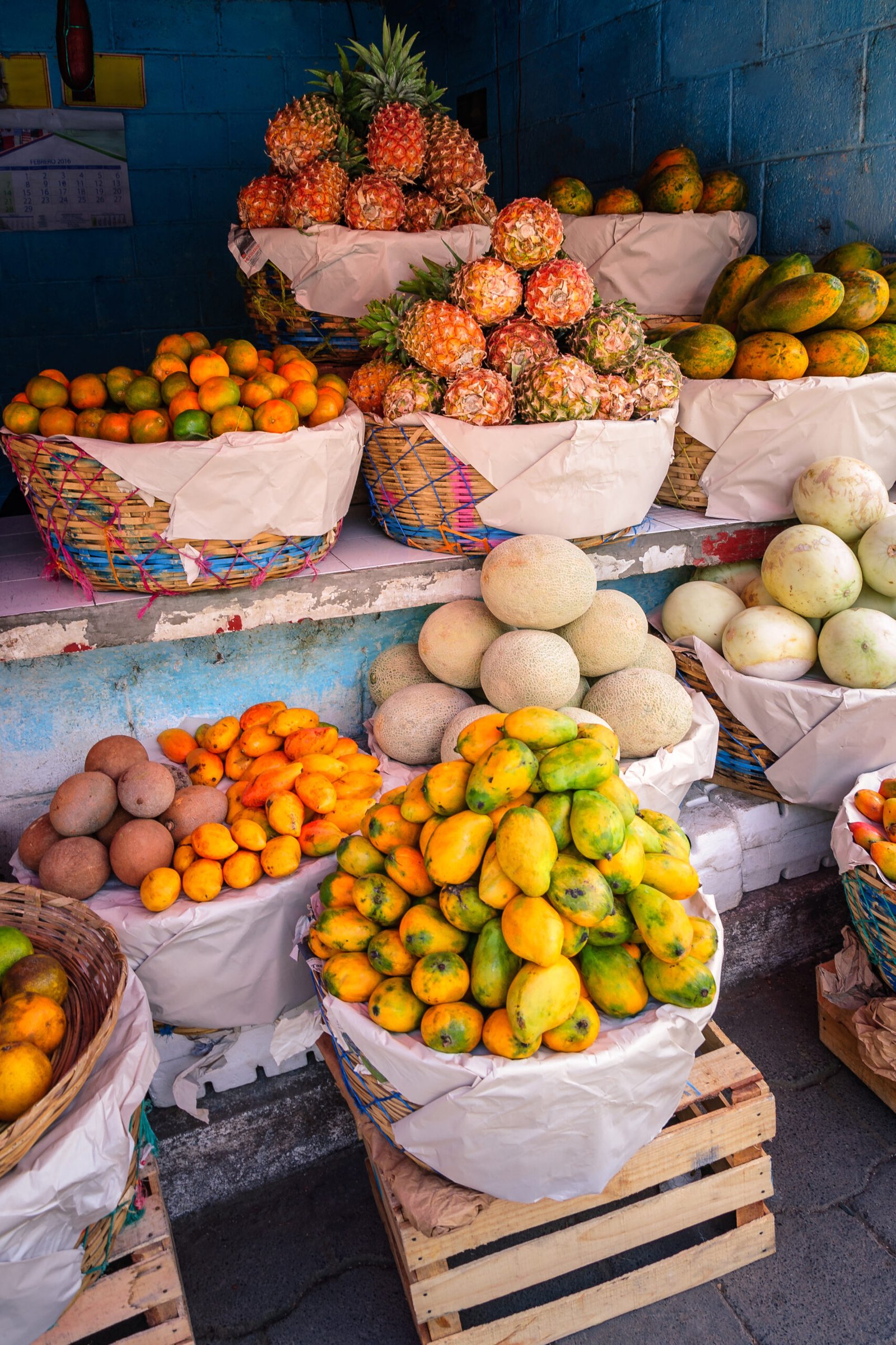 Tropical colorful fruit stand on the road in the remote village San Juan La Laguna in the highlands of Guatemala.