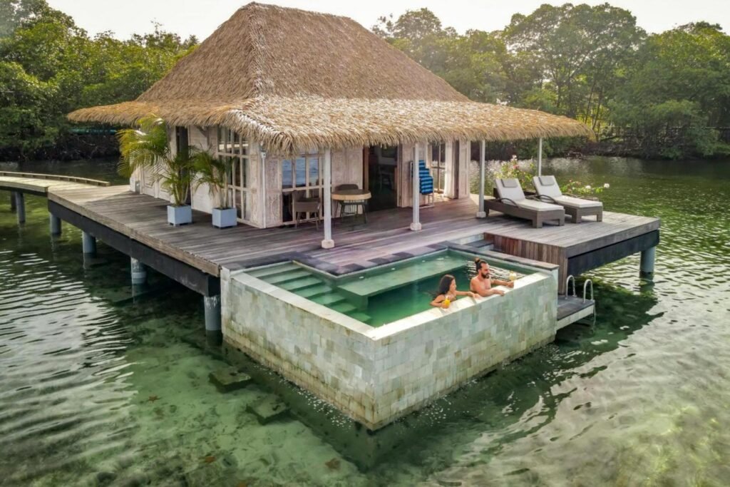 Nayara Bocas del Toro deluxe overwater villa with couple in a plunge pool, romantic travel, couples travel, honeymoon