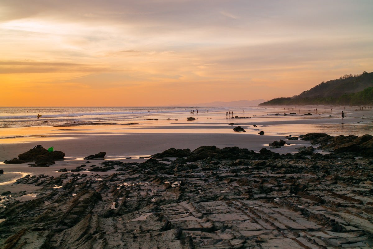 Costa Rica Santa Teresa honeymoon destinations, beach at sunset, pink skies along coastline